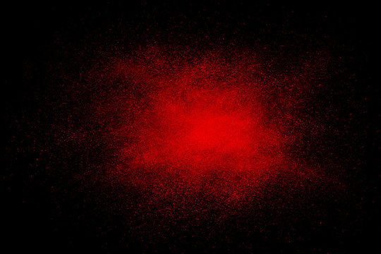 Red abstract powder explosion on a black background
