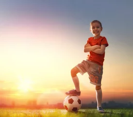 Foto auf Acrylglas Child plays football. © Konstantin Yuganov