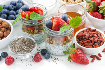 Breakfast in a jar, chia with berries and oat flakes 