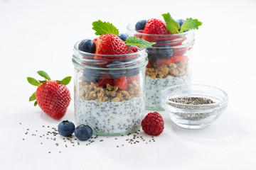 Breakfast in a jars, chia with berries and oat flakes 