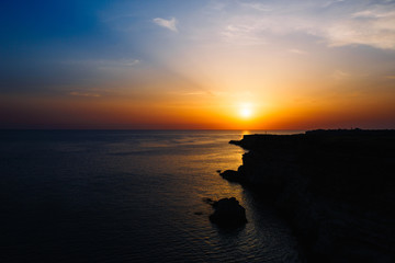 Sunset on the rocky seashore, Cape Fiolent, Crimea