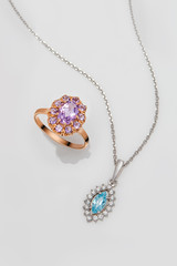 Jewelry set of gold ring and silver pendant with pink and blue t