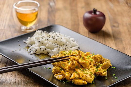 curry chicken and oriental rice in a dish