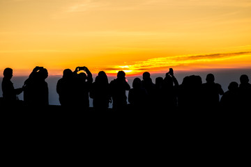 Fototapeta premium silhouette People on Mountain sunrise time in morning