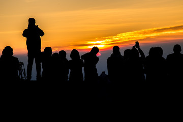 Fototapeta premium silhouette People on Mountain sunrise time in morning