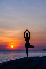 Yoga at sunset time