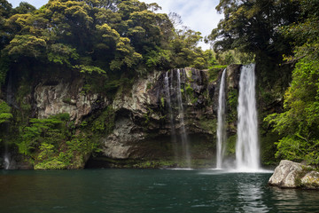Fototapeta na wymiar Cheonjiyeon Waterfall on Jeju Island in South Korea.