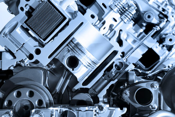 Cut section showing details of automotive engine 