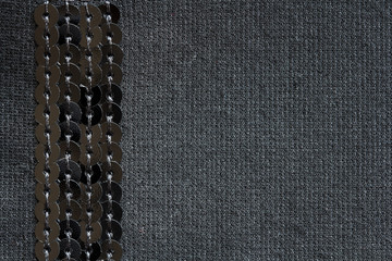 black knitted fabric with sequins,  background