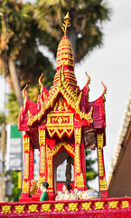 Outdoor spirit house in Thailand. garland and some wreathes, joss house.