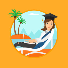 Graduate lying in chaise lounge with laptop.