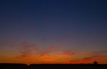 Beautiful after sunset sky over fields in Poland.