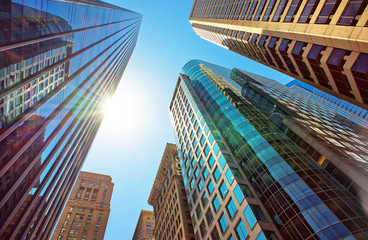 Fototapeta na wymiar Bottom-up view of skyscrapers mirrored in glass in Philadelphia