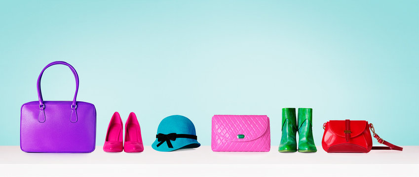 Woman accessories shopping items isolated on pastel color blue background. Shoes and purse bags and hat. with copy space. 