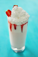 Fresh milk cocktail on wooden background