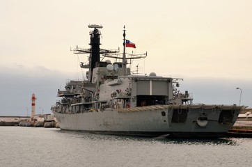Long shot of a navy or military ship in the harbour of Valparaiso