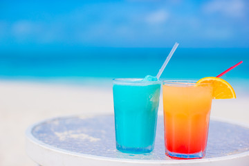 Two tasty cocktails on tropical white beach