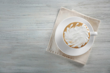 Cup of coffee on wooden table