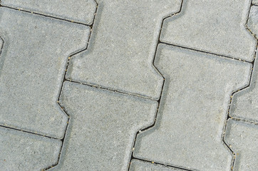 Grey paving slabs as a background close-up image