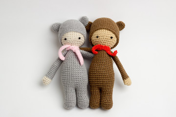 Teddy bear, toy crochet, with a scarf around his neck, brown and