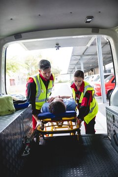 Injured man with ambulance men