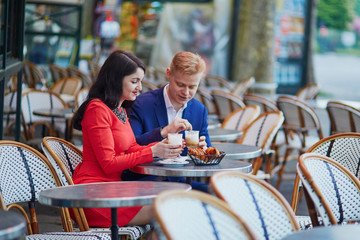 Romantic couple in Paris in cafe