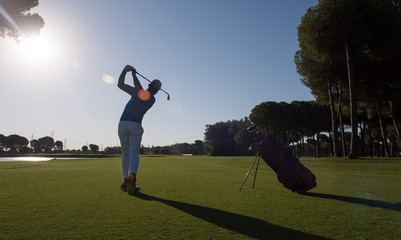 golf player hitting shot