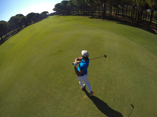 top view of golf player hitting shot