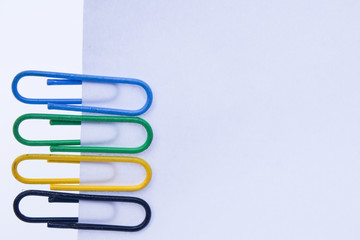 Collection of colorful paper clips with space for texture