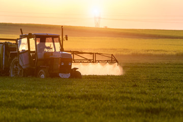 Sunset above spraying machine