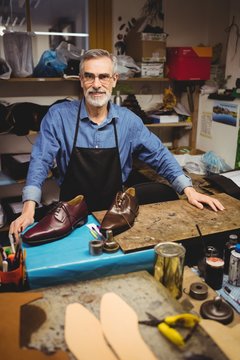 Portrait of cobbler smiling and posing