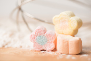 Colorful marshmallows on flour background prepare for baking