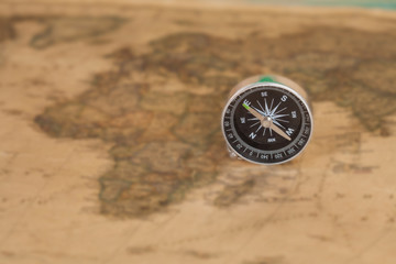 vintage compass on old map
