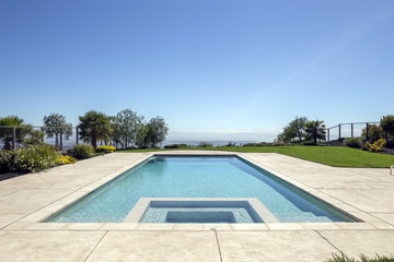 Amazing luxury pool with city in background.