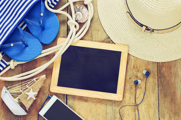 beach accessories and blank blackboard. copy space © tomertu