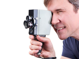 Fototapeta premium Retro movie camera in hands of operator isolated