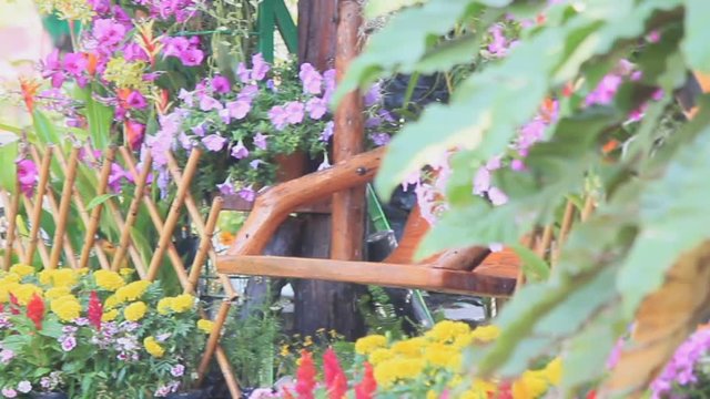 Wood swing in the flowers garden, HD vdo./ Wood swing in the flowers garden on summer, HD vdo.