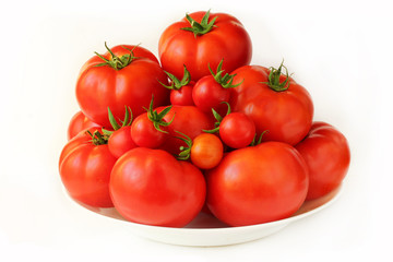 Ripe cherry tomatoes and a large tomato isolated