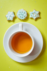Image of three ginger cookies and cup of tea