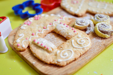 close up on gingerbread house over wooden desk green background