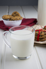 Very sweet retro bottle of milk with cookie on old table
