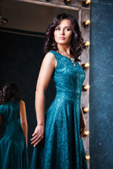Obraz premium portrait of beautiful elegant young woman in gorgeous evening dress