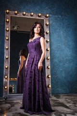 Obraz premium portrait of beautiful elegant young woman in gorgeous evening dress