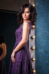 Obraz premium portrait of beautiful elegant young woman in gorgeous evening dress
