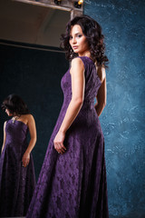 Obraz premium portrait of beautiful elegant young woman in gorgeous evening dress