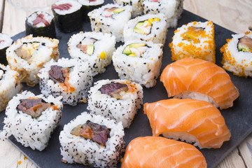 Sushi rolls on a slate plate