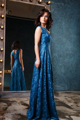 Obraz premium portrait of beautiful elegant young woman in gorgeous evening dress