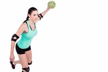 Female athlete with elbow pad throwing handball