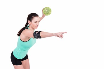 Female athlete with elbow pad throwing handball