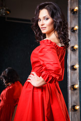 Obraz premium portrait of beautiful elegant young woman in gorgeous summer dress